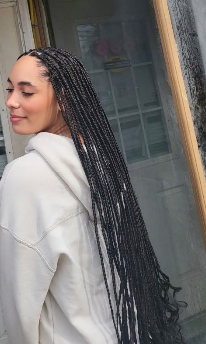 Effizzi client wearing a finished braided style