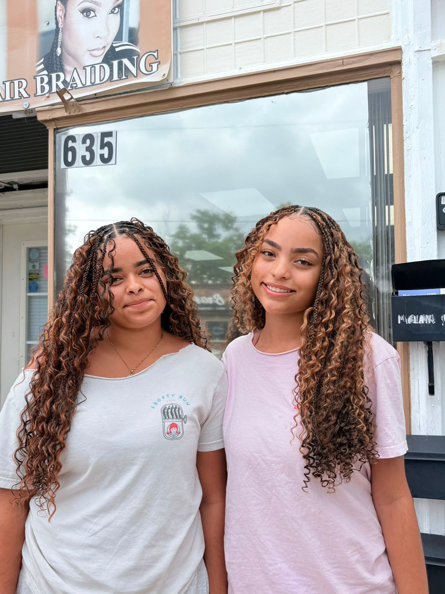 Two Effizzi clients with boho braids outside the salon